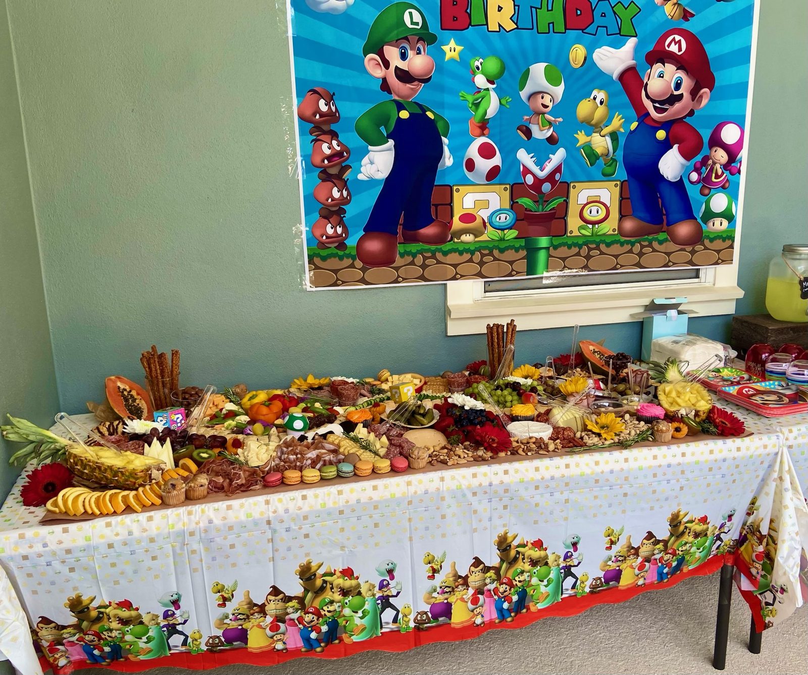 Birthday party grazing table styled for a kids' celebration